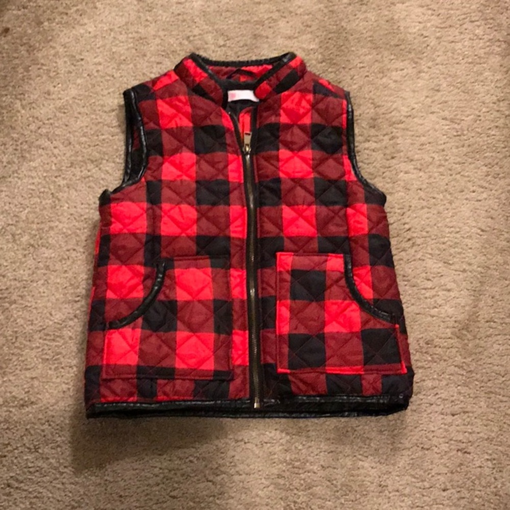 Black and red checkered vest.